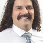 A headshot of Hiram Garcia.