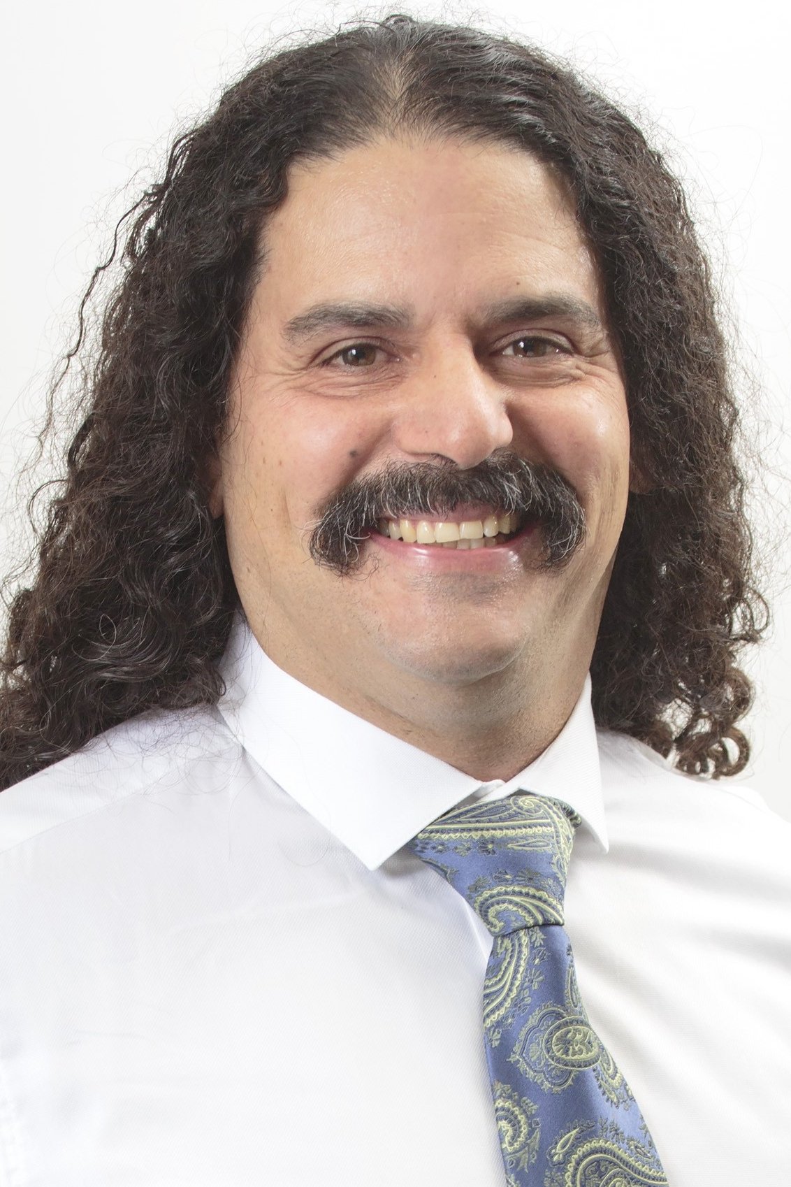 A headshot of Hiram Garcia.