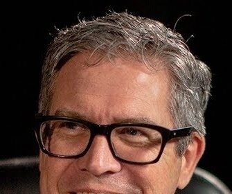 A headshot of John Powell.