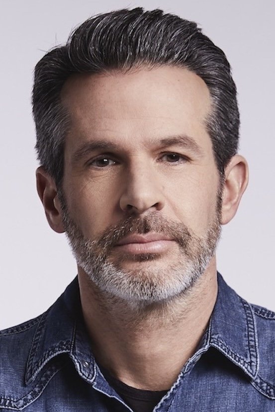 A headshot of Simon Kinberg.