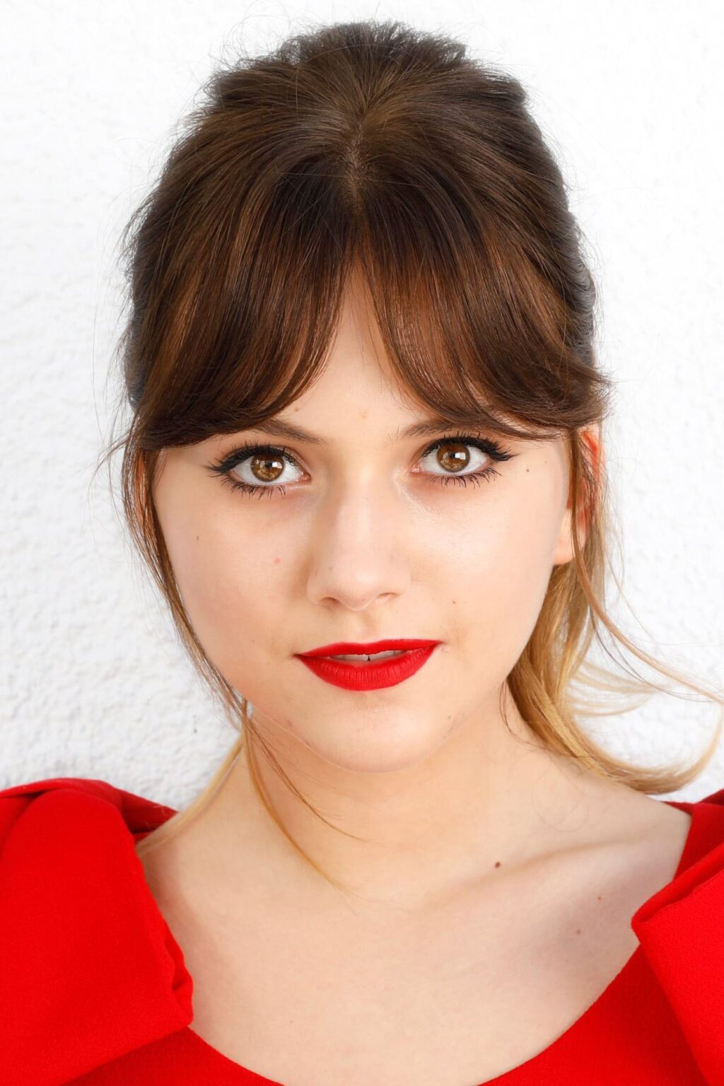 A headshot of Emilia Jones.