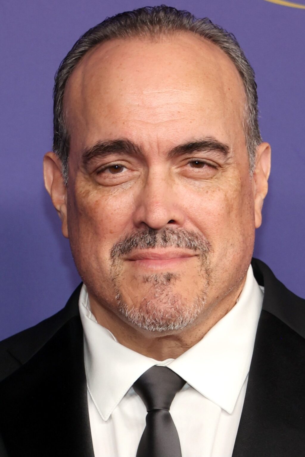 A headshot of David Zayas.