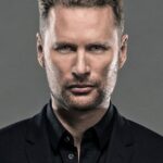 A headshot of Brian Tyler.