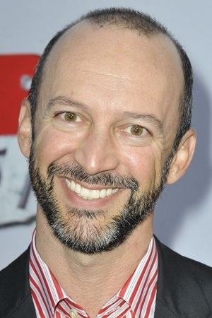 A headshot of J.P. Manoux.