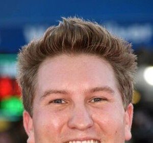 A headshot of Nate Torrence.