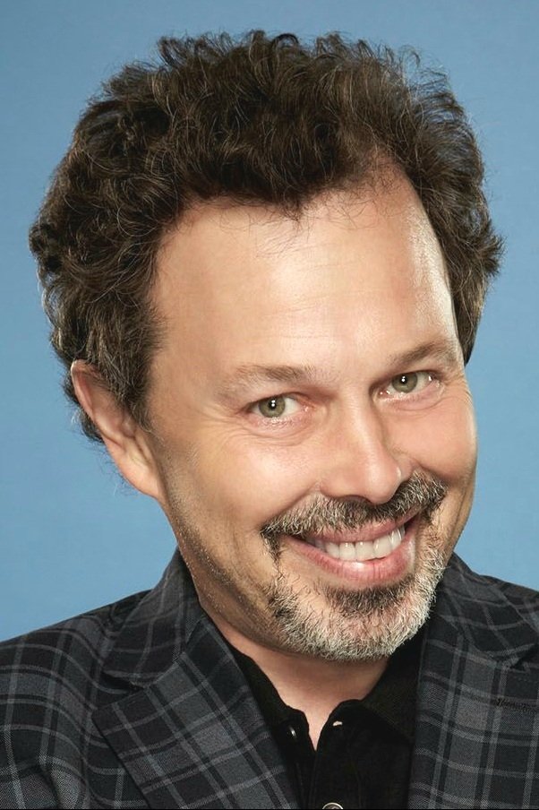 A headshot of Curtis Armstrong.