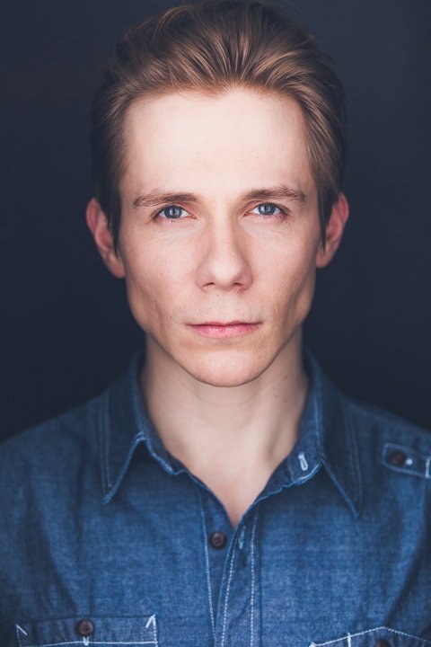 A headshot of David Armstrong.