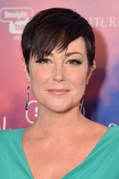 A headshot of Kim Rhodes.
