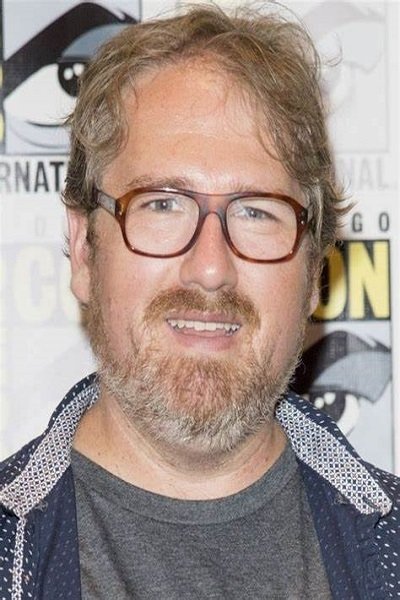 A headshot of Andrew Dabb.