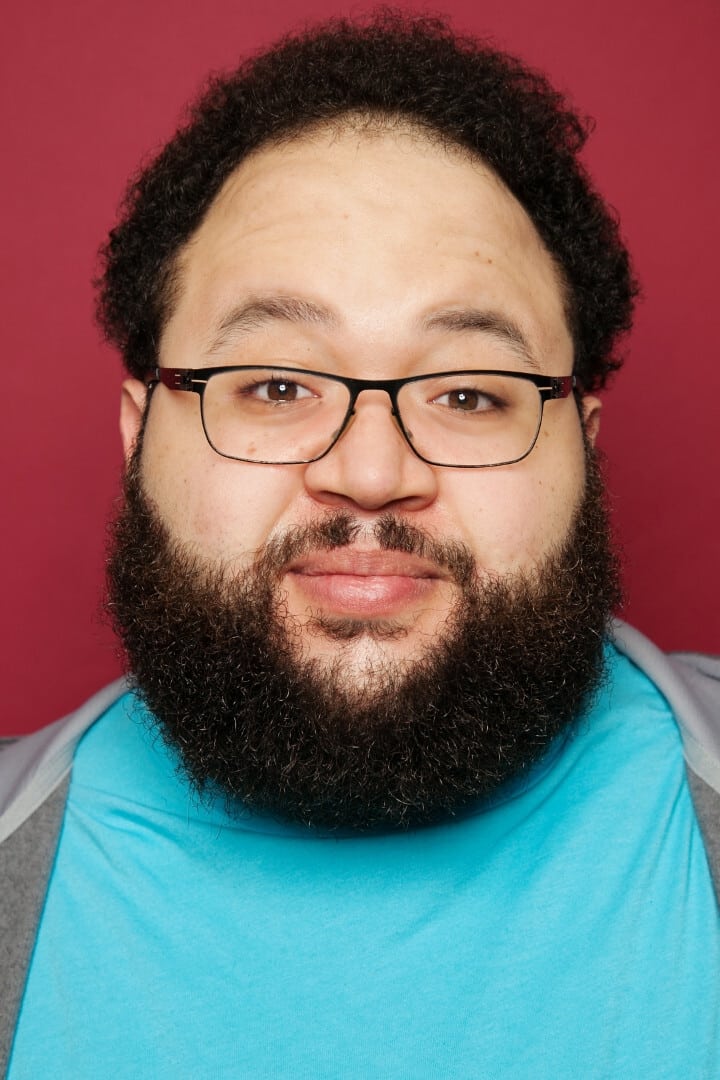 A headshot of Zach Cherry.