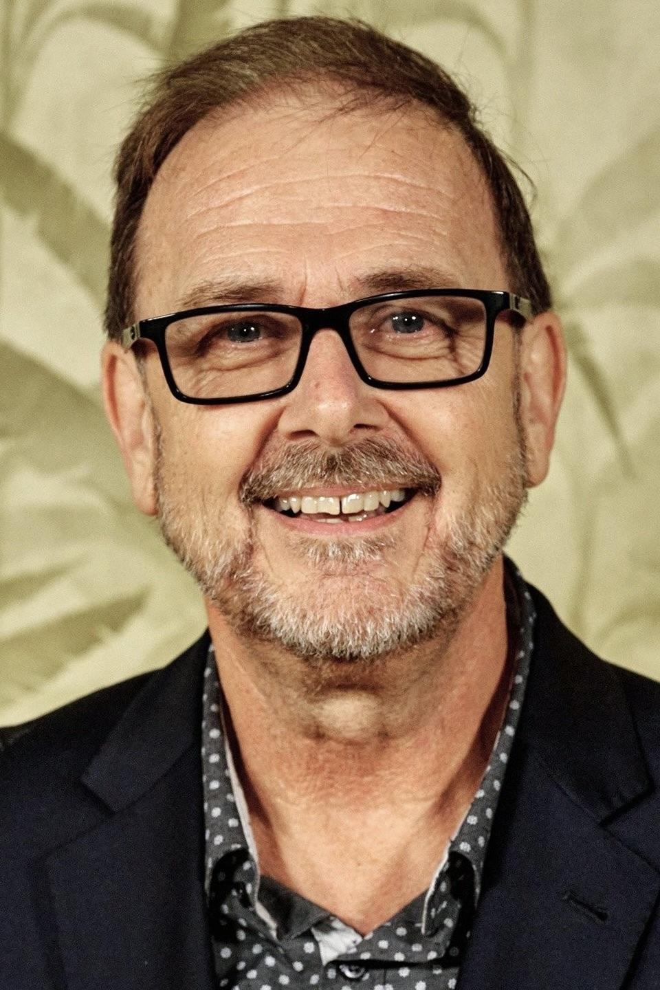 A headshot of Chris Long.