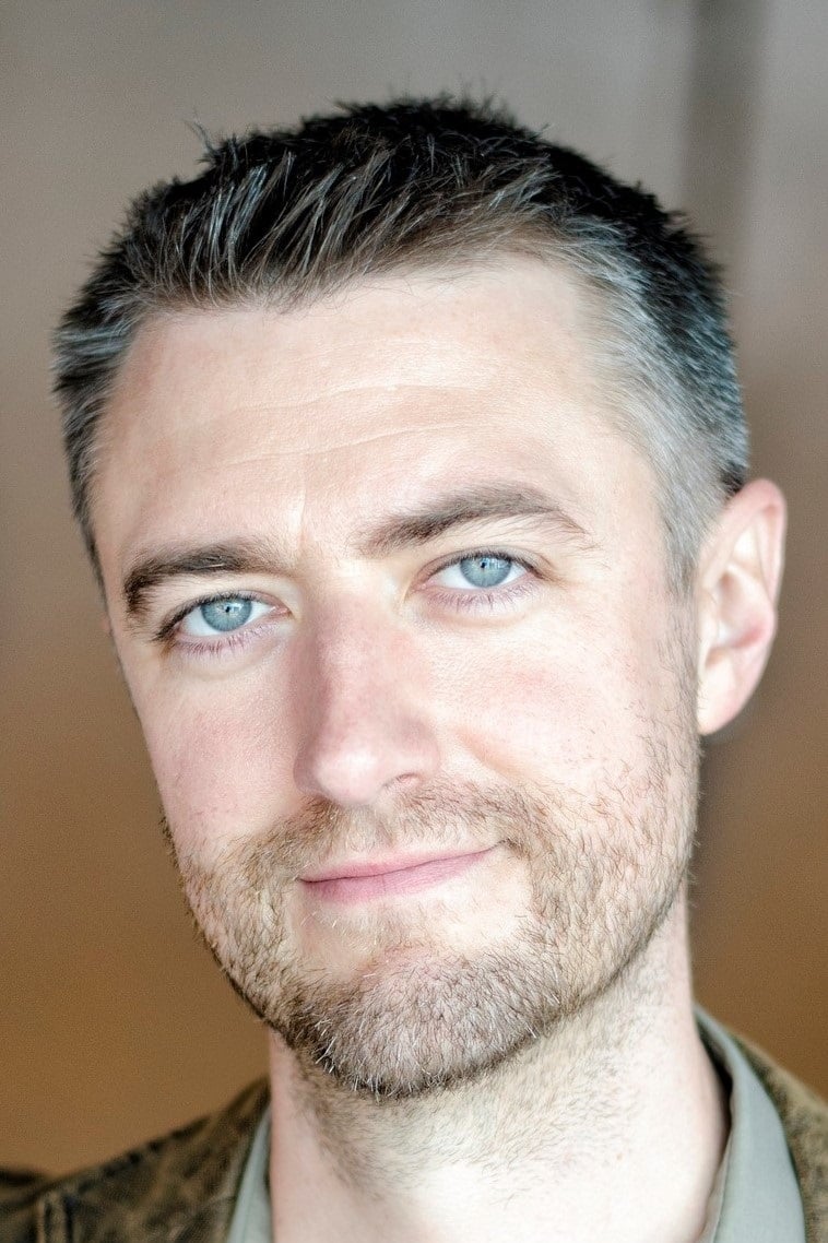 Official headshot photo of person: Sean Gunn.